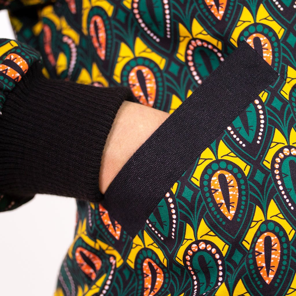 Schwarze Damen Bomberjacke mit grün gelbem Print 'Peacock - Khala